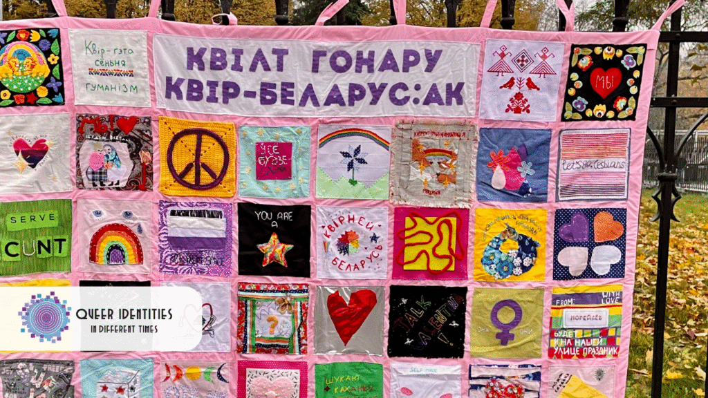 A blanket made of colorful patches sewn together.