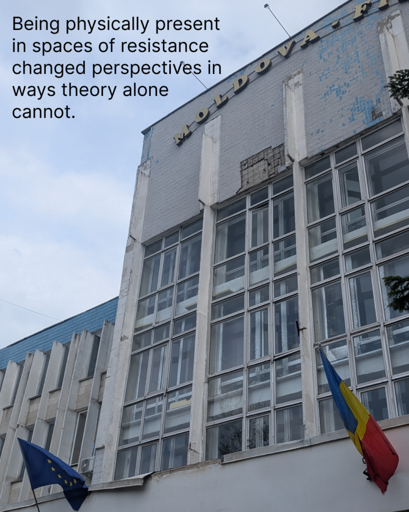 There is an old Moldova film building with Moldovan and EU flags on it. The building is grey and has many windows. The sky is blue, but with many clouds. There is a text in the background: being physicaly present in spaces of resistance changed perspectives in ways theory alone cannot.